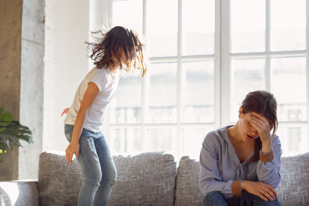 upset mother having problem with noisy naughty daughter